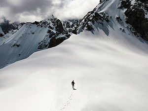 A person walking from Aiguile du Midi into the mountains