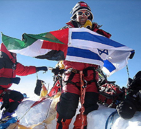 he Everest Peace Project holding sewed flags from Palestine and Israel