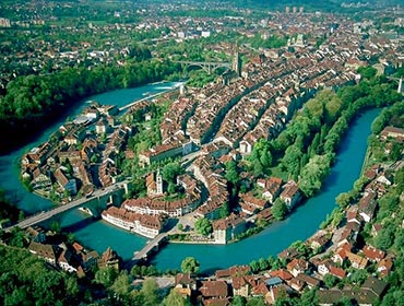 An aerial view of Bern's Old Town, surrounded by the turquoise River Aare