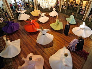 Whirling Dervishes from Turkey. They belong to a Sufi Islamic sect called the Mevlevi founded by the famous philosopher Mevlana. Picture was taken from the top viewing gallery.