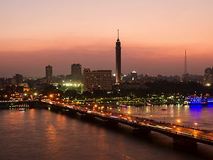 Late evening in Cairo: view of the Qasr al-Nil Bridge and the Cairo Tower at sunset.