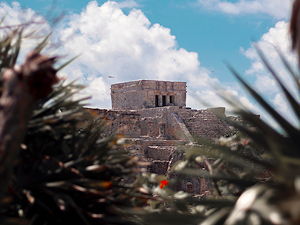 The ruins of Tulum hidden behind trees
