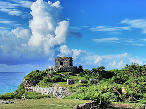 Tulum's Temple of Wind God on the left and Castle on the right
