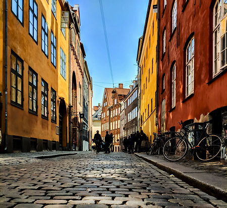 A low angle view of the colorful cobblestone streets of Copenhagen, Denmark