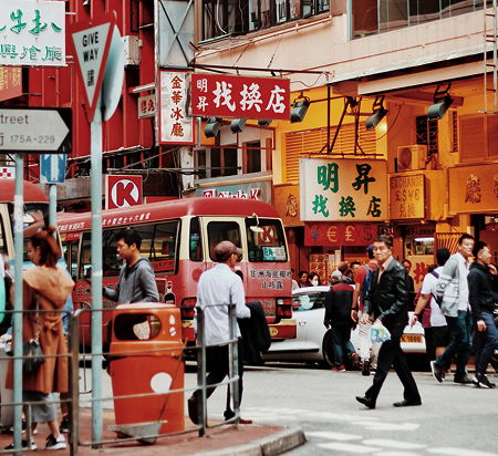 Pedestrians crossing in a busy area in Hong Kong, China