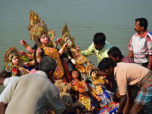 Durga image is immersed into river
