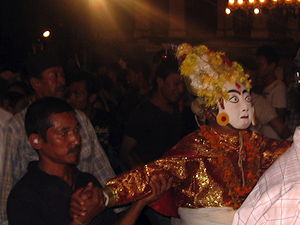 Masked man representing the goddess Dagin