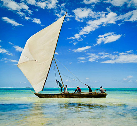 A dhow sailing on Zanzibar's pristine turquoise waters