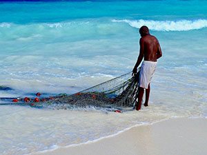 A fisherman checking his net at Kendwa beach