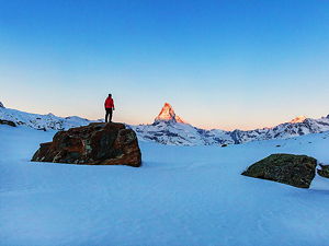 Man standing in front of Matterhorn near Zermatt, Switzerland