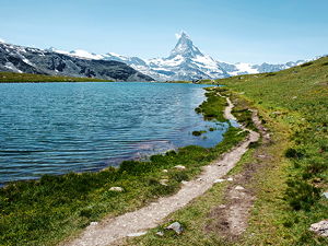 A walking path close to a lake near Zermatt